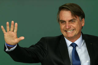 Jair Bolsonaro após a sanção da lei que aprovou o cadastro positivo no Brasil