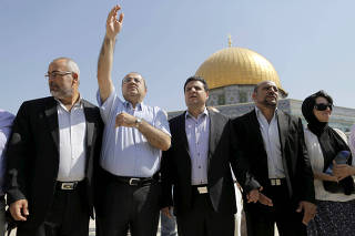 FILE PHOTO: Israeli Arab lawmakers stand in front of Dome of the Rock in Jerusalem