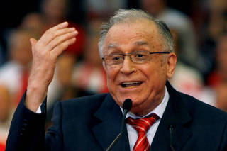 FILE PHOTO: Romania's former President Ion Iliescu gestures while announcing his support for the head of Romania's Social Democrat party, Mircea Geoana, in Bucharest