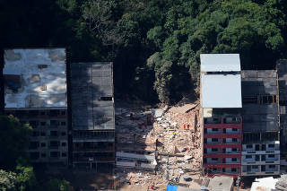 An aerial view of two collapsed buildings in Muzema community, Rio de Janeiro