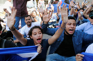 Demonstrators shouts slogans during a march to mark the one year anniversary of the protests against Nicaraguan President Daniel Ortega's government in Managua
