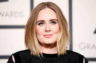 FILE PHOTO: Adele arrives at the 58th Grammy Awards in Los Angeles