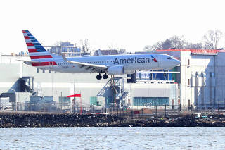 FILE PHOTO: An American Airlines Boeing 737 Max 8, on a flight from Miami to New York City, comes in for landing at LaGuardia Airport in New York