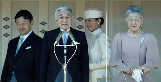 FILE PHOTO : Japan's Emperor Akihito appears with Empress Michiko, Crown Prince Naruhito and Crown Princess Masako to well-wishers gathered to celebrate the monarch's 77th birthday at the Imperial Palace in Tokyo