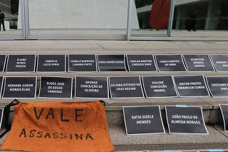 Demonstrators place placards with names of victims of a collapsed tailings dam owned by Vale SA, during an assembly of shareholders, in front of the Brazilian mining company Vale SA bulding in Rio de Janeiro