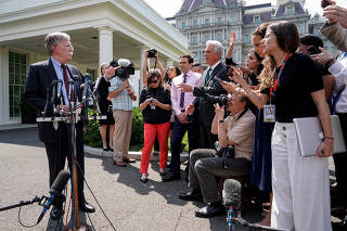 White House national security adviser Bolton takes questions about the political unrest in Venezuela, outside the White House in Washington