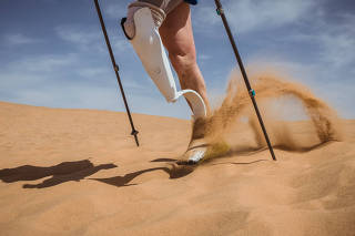 Amy Palmiero-Winters navigates a sand dune during day three of the Marathon des Sables, a 140-mile, six day ultramarathon through the Sahara Desert in Morocco.