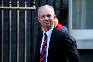 FILE PHOTO: Britain's Minister for the Cabinet Office David Lidington is seen outside Downing Street in London