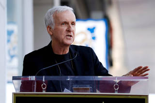 FILE PHOTO: James Cameron speaks during the ceremony for the unveiling of Zoe Saldana's star on the Hollywood Walk of Fame in Los Angeles