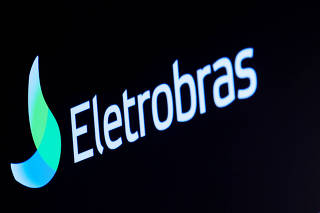 The logo for Eletrobras, a Brazilian electric utilities company, is displayed on a screen on the floor at the NYSE in New York