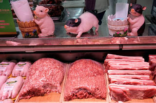 Pork for sale is seen at a supermarket in Beijing