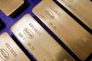 Marked ingots of 99.99 percent pure gold are placed in a cart at a plant of Krastsvetmet in Krasnoyarsk