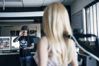 Matt McMullen in the virtual reality lab at his company, Realbotix, with Harmony, the first sex robot, in San Marcos, Calif.