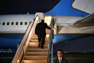 U.S. Secretary of State Mike Pompeo boards a plane before departing from Baghdad International Airport in Baghdad