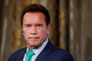 FILE PHOTO: R20 Founder and former California state governor Arnold Schwarzenegger attends a news conference ahead of the One Planet Summit in Paris