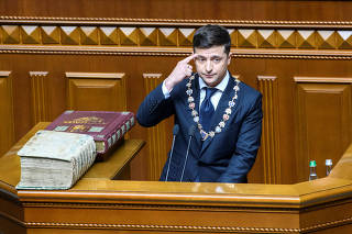 Ukraine's President-elect Zelenskiy takes the oath during his inauguration ceremony in the parliament hall in Kiev