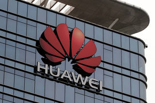 FILE PHOTO: The Huawei logo is pictured outside its Huawei's factory campus in Dongguan, Guangdong province