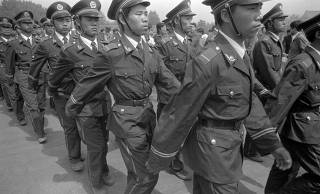 Armed police officers marching during the Tiananmen Square Protest in Beijing in 1989.