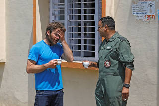 British Climber and expedition?s deputy leader, Mark Thomas reacts as he talks to an Indian Air Force pilot in Pithoragarh