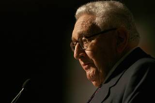 Former U.S. Secretary of State Henry Kissinger addresses a conference in Istanbul