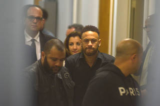 Brazilian soccer player Neymar leaves the police station after testifying in Rio de Janeiro
