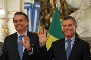 Argentina's President Mauricio Macri, and Brazil's President Jair Bolsonaro pose for a picture at the Casa Rosada government house in Buenos Aires