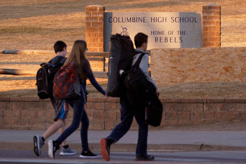 FILE PHOTO: Students arrive for class at Columbine High School before participating in a National School Walkout to honor the 17 students and staff members killed at Marjory Stoneman Douglas High School in Parkland, Florida, in Littleton, Colorado, U.S., March 14, 2018. REUTERS/Rick Wilking/File Photo ORG XMIT: FW1