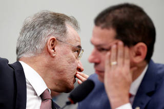 Brazilian Federal Deputy Samuel Moreira speaks with Brazilian Federal Deputy Marcelo Ramos during a session of the commission of the pension reform bill at the National Congress in Brasilia