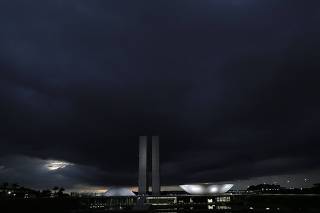 A general view of clouds above Brazil's National Congress headquarters before heavy rains in Brasilia