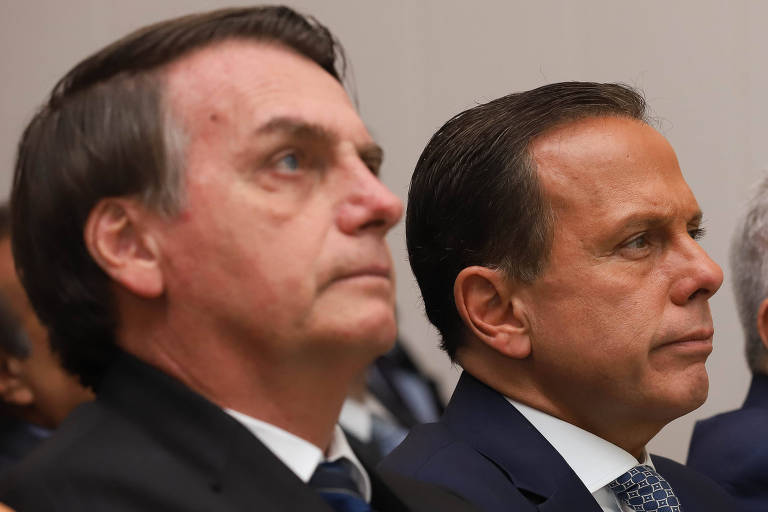 O presidente Jair Bolsonaro (esq.) e o governador de São Paulo, João Doria, em evento na capital paulista