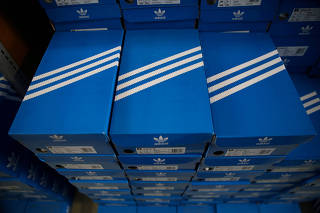 FILE PHOTO: Boxes of Adidas shoes are pictured in the warehouse of local footwear retailer 
