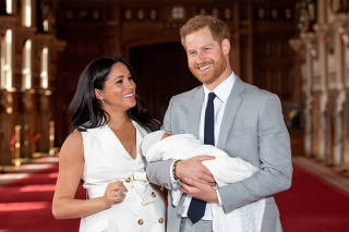 FILE PHOTO: Britain's Prince Harry and Meghan, Duchess of Sussex with their baby son at Windsor Castle