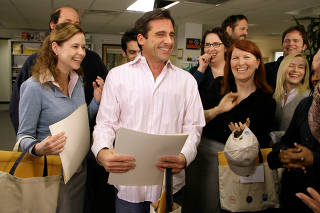 FILE PHOTO: Actor Steve Carell laughs along with other members of 