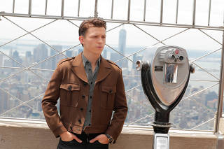 Actor Tom Holland poses for a photograph on top of the Empire State Building to promote the film, Spider-Man: Far From Home in New York