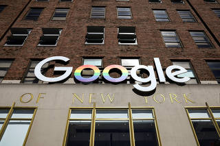 The Google logo is displayed outside the company offices in New York