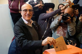 Former mayor of Montevideo Daniel Martinez of the Frente Amplio casts his vote during primary elections ahead of the presidential elections later this year, in Montevideo
