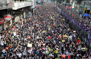 Anti-extradition bill protesters march during the anniversary of Hong Kong's handover to China in Hong Kong