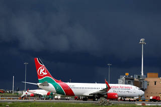 FILE PHOTO: Kenya Airways planes are seen parked during a pilots strike organised by KALPA at the Jomo Kenyatta International airport near Kenya's capital Nairobi