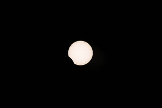 A partial solar eclipse is observed at Coquimbo