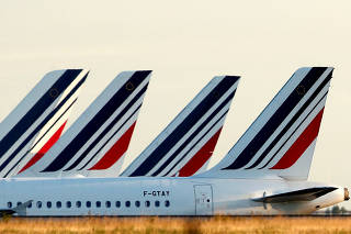 FILE PHOTO: Tails of Air France airplanes are seen at the Charles-de-Gaulle Airport in Roissy