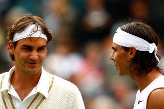 FILE PHOTO: Switzerland's Roger Federer and Spain's Rafael Nadal at the Men's Singles Final
