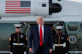 U.S. President Donald Trump arrives from a fund-raising event before departing for Washington D.C.,  at Cleveland Hopkins International Airport in Cleveland