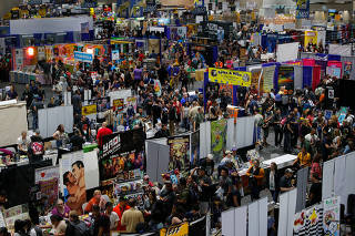 Attendees of the pop culture festival Comic Con International gather for opening night in San Diego, California