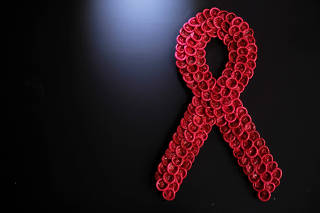 Condoms form the red ribbon, which represents the international symbol for AIDS at a wall of establishment in Sao Paulo