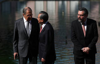 Russia's Foreign Minister Sergei Lavrov, China's Foreign Minister Wang Yi and Brazil's Foreign Minister Ernesto Araujo, are pictured during a BRICS foreign ministers meeting in Rio de Janeiro