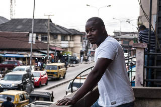 Akinola Bolaji, 35, who said he has posed on Facebook as an American fisherman named Robert, in Lagos, Nigeria, on April 18, 2019. (The New York Times)