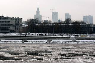 View of the cityscape is pictured over the Vistula River covered with ice floes as cold winter temperatures hit Poland in Warsaw