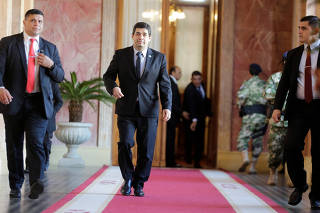 Paraguay's Vice President Hugo Velazquez leaves after a meeting at the Lopez palace in Asuncion