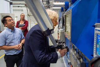 Britain's Prime Minister Boris Johnson visits the Fusion Energy Research Centre at the Fulham Science Centre in Oxfordshire