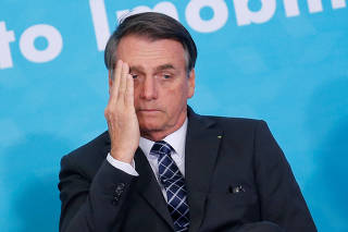 Brazilian President Jair Bolsonaro gestures during the launching ceremony of the real estate credit program at the Planalto Palace in Brasilia